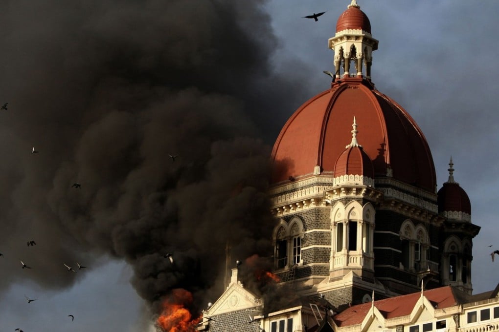 Fire and smoke billows from the Taj Mahal Palace hotel in Mumbai in November 2008. Photo: AFP
