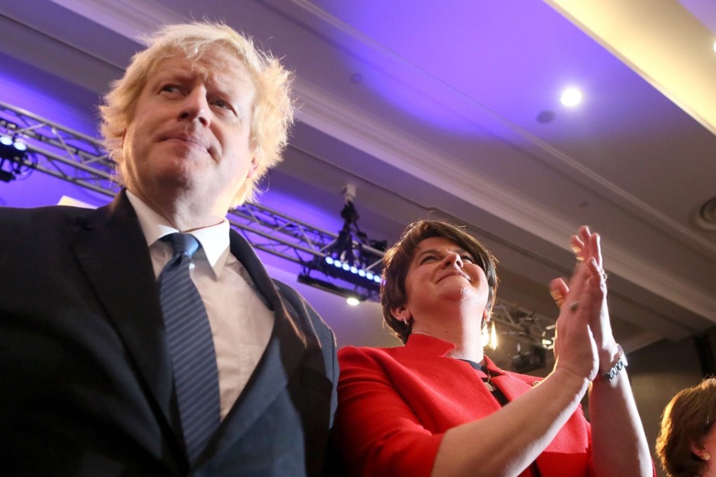 Former British Foreign Secretary Boris Johnson (left) and leader of the DUP Arlene Foster participate in the Democratic Unionist Party (DUP), Annual Conference in Belfast. Photo: AFP