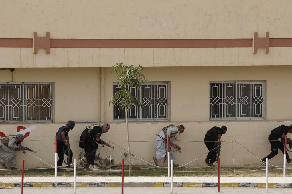 Pakistani paramilitary soldiers take position after militants attacked a hospital in Quetta, the capital of Balochistan province in 2013. Photo: AFP