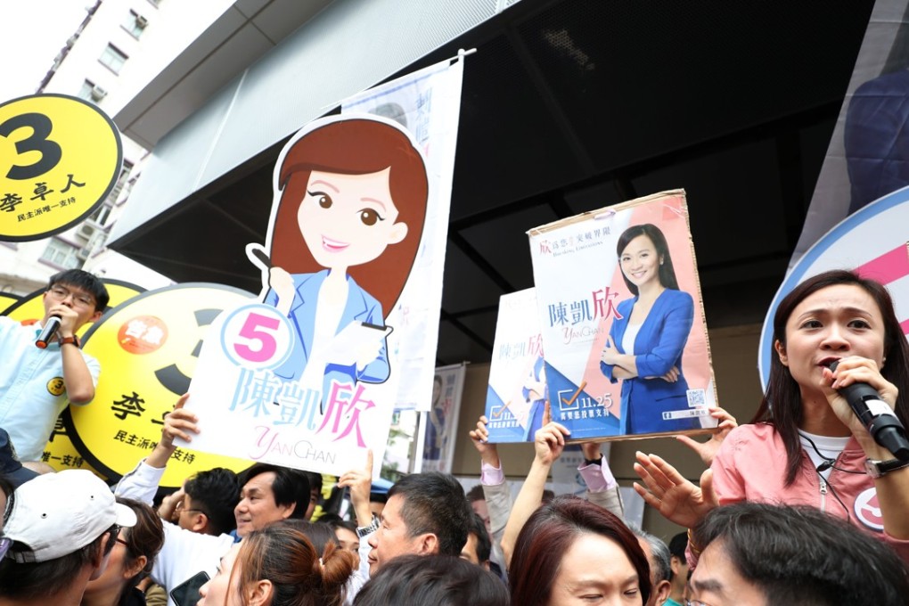 Chan Hoi-yan (right) campaigns in Whampoa. Joshua Wong (left, in green shirt) calls for support of Labour Party candidate Lee Cheuk-yan. Photo: Edward Wong