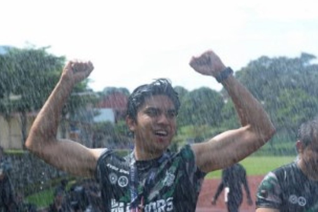 Syed Saddiq completes the Warriors Challenge obstacle course in pouring rain. Photos: social media