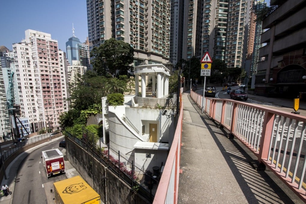 Historic buildings such as the Ohel Leah synagogue cling on in Mid-Levels amid the soaring modern skyscrapers that have largely replaced the mansions of old. Photo: Christopher DeWolf