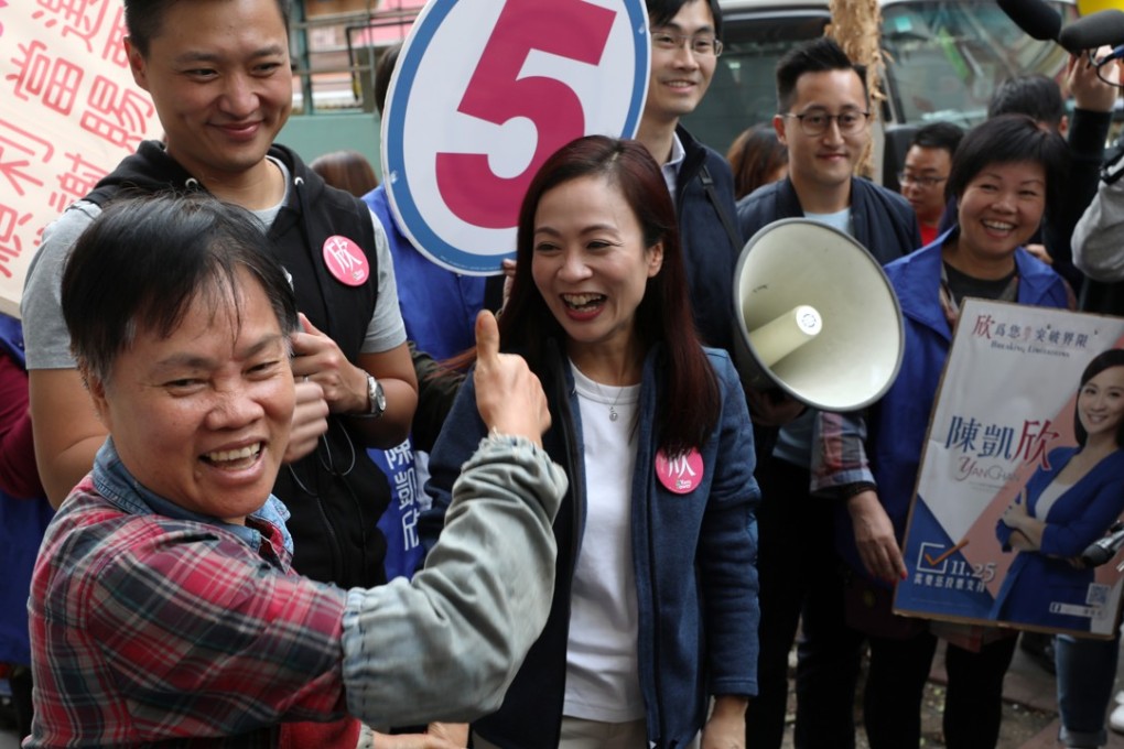 Rebecca Chan Hoi-yan (centre), who won the Kowloon West by-election, thanks voters in Kowloon City. Photo: Robert Ng