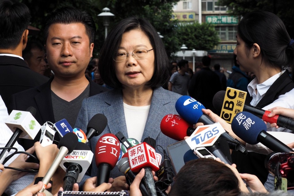 President Tsai Ing-wen, centre, resigned as chairwoman of the pro-independence ruling party DPP after a rout at the polls in Taiwan at the weekend. Pro-Beijing media claim the vote in favour of the KMT was a rejection of independence. Photo: EPA