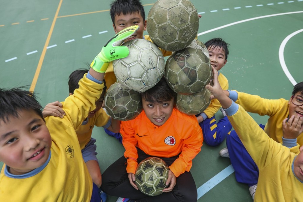Wai Yuen-ting has a bit of fun with her students at the Alliance Primary School in Whampoa, Hung Hom. Photo: Xiaomei Chen