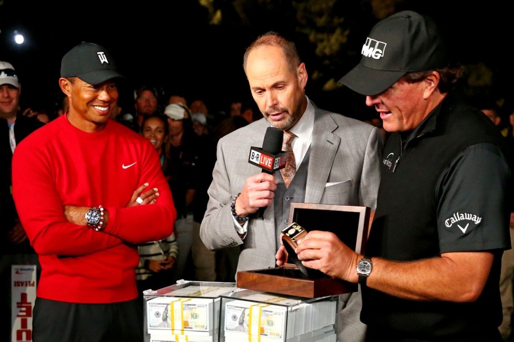 Phil Mickelson reacts with the winner's belt after beating winning The Match: Tiger vs Phil golf match at Shadow Creek Golf Course. Photo: USA Today