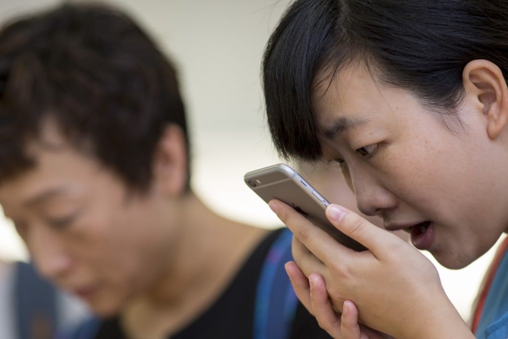 Chinese artificial intelligence company iFlytek is now removing politically sensitive words, phrases and names from its popular translation app, iFlyTranslate. Photo: Bloomberg