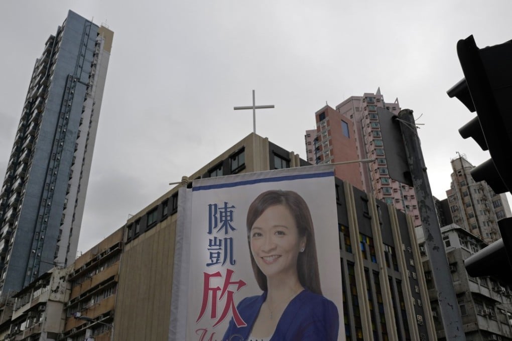 A poster for pro-establishment candidate Chan Hoi-yan hangs on a street corner after she won the West Kowloon by-election in Hong Kong. Photo: AP