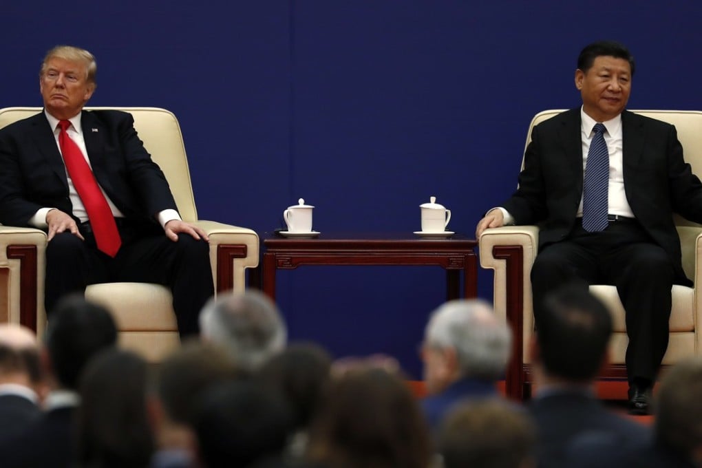 Donald Trump and Xi Jinping attend a business event in Beijing last year. The US president has turned up the heat in the trade war ahead of their meeting this week. Photo: AP