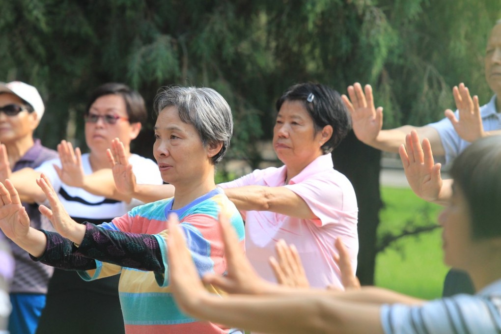 Older Chinese exercise in Ditan Park in Beijing in June 2016. Beijing's parks have become a common place for older people to spend their time in the morning, where they can gather with friends or take care of their grandchildren. Photo: Simon Song