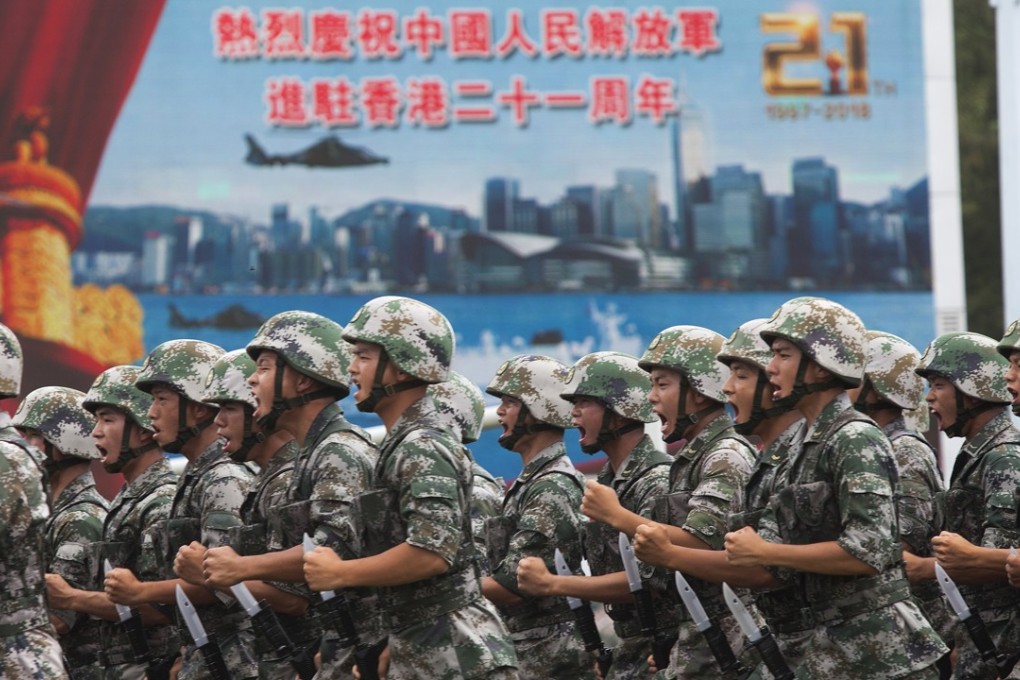 Soldiers demonstrate combat exercises at a People’s Liberation Army (PLA) barracks open day to mark the 21st anniversary of the Hong Kong handover of sovereignty from Britain to China at the Ngong Shuen Chau Naval Base in Kowloon. Photo: EPA-EFE