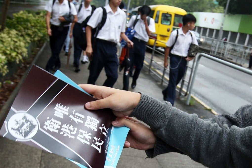 Localist groups hand out pro-independence fliers outside a high school in Sha Tin, in November 2017. Photo: David Wong