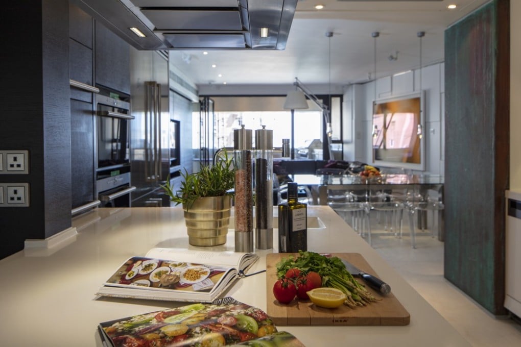 The kitchen looks out over the light-filled living and dining space. Photography and video: John Butlin. Styling: Aviva Duncan. Photography assistant: Timothy Tsang