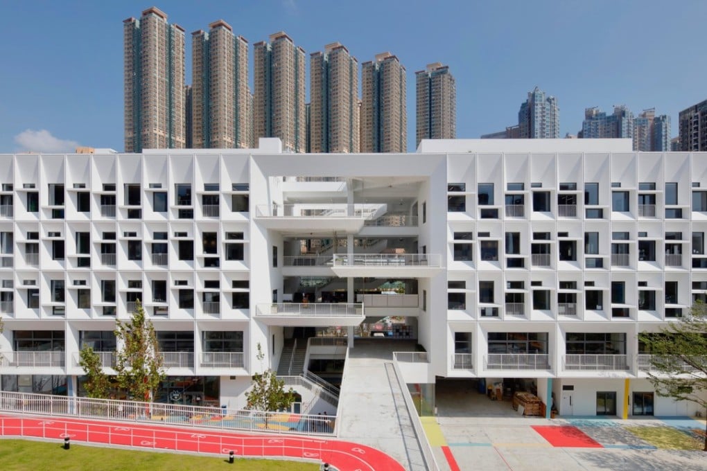The new French International School campus in Tseung Kwan O, Hong Kong, has a brise-soleil facade that reflects sunlight – one of a number of eco-friendly design measures designed to promote the wellness of students and staff. Photo: Philippe Ruault