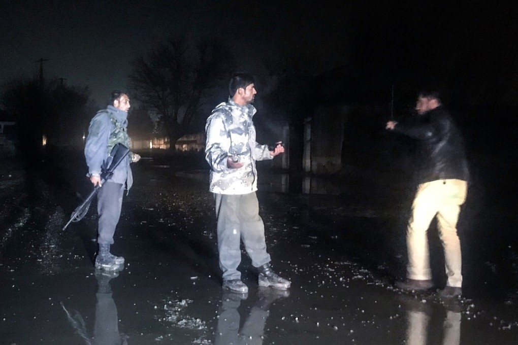 Afghan security personnel inspect the site of a car bomb blast which targeted a British security contractor group G4S in Kabul. Photo: EPA-EFE