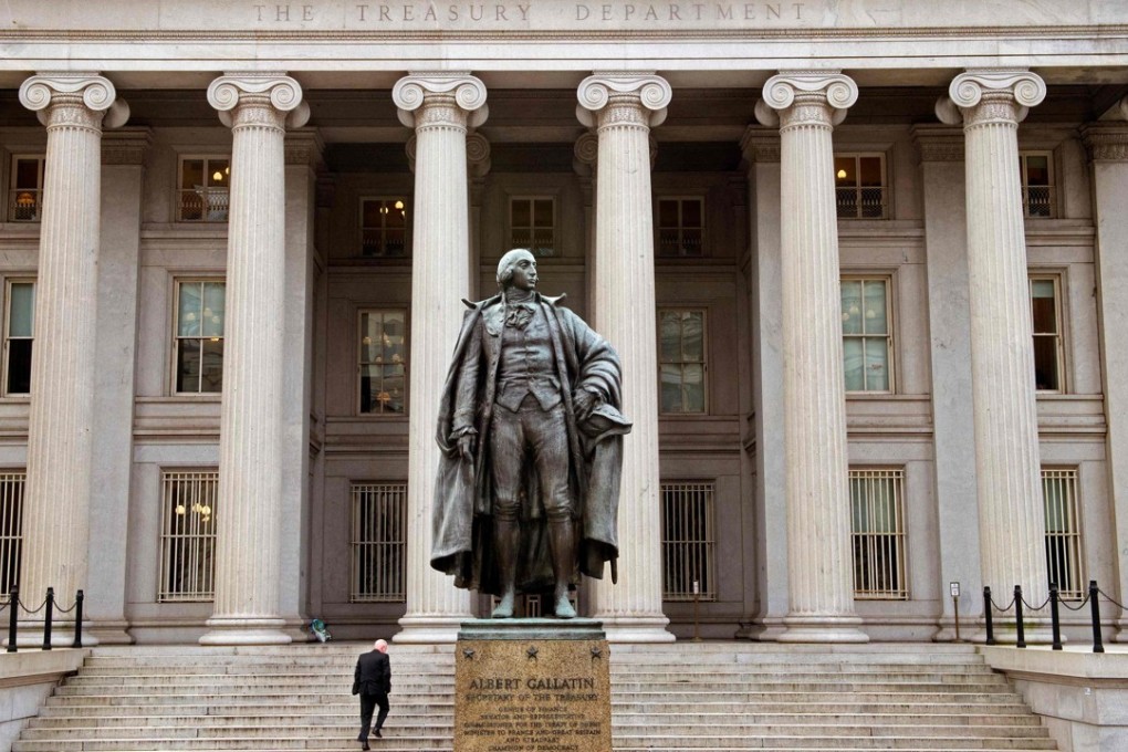 A man enters the US Treasury Department building on Pennsylvania Avenue in Washington in January 2017. The 3-month Treasury yield is higher than the average 12-month dividend yield on the S&P 500 equity index for the first time in a decade. Photo: AFP