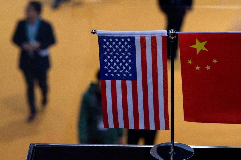 US and Chinese flags in Shanghai. Photo: AFP