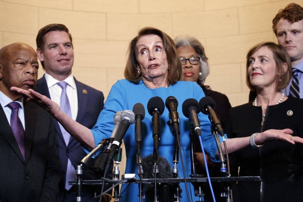 House Minority Leader Nancy Pelosi (centre) – joined by from left, Representatives John Lewis, Eric Swalwell, Joyce Beatty, Kathy Castor, and Joe Kennedy – gestures as she speaks to media at Longworth House Office Building on Capitol Hill in Washington on Wednesday to announce her nomination by House Democrats to lead them in the new Congress. Photo: AP