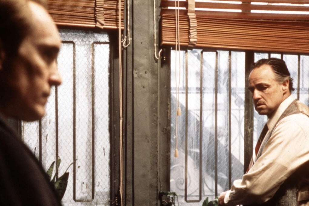 Tom Hagen (Robert Duvall, left) and Don Vito Corleone (Marlon Brando) in a still from The Godfather.