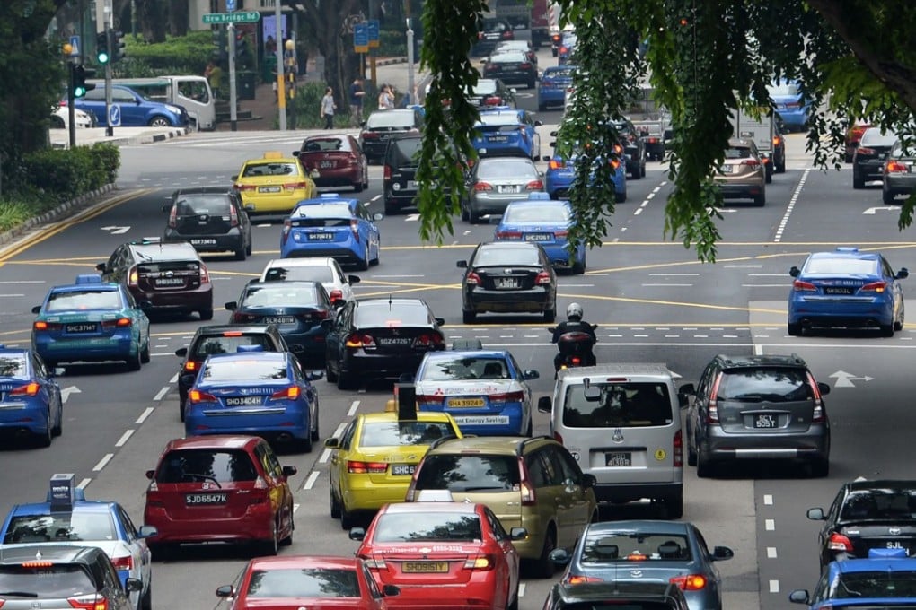Popularity of ride-hailing services including Uber and Grab have exacerbated traffic problems. Photo: AFP