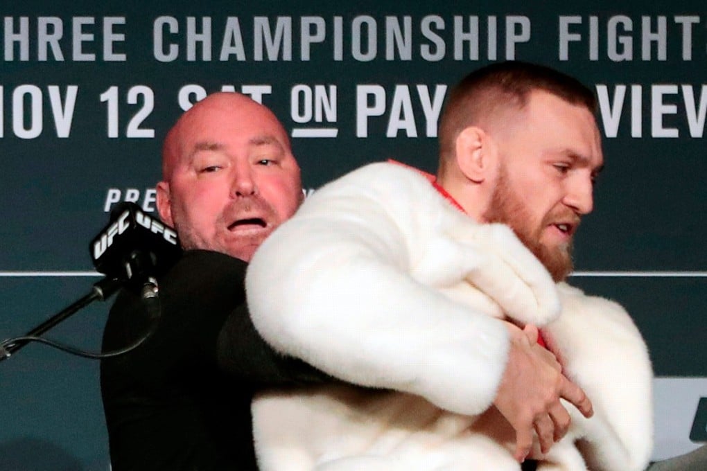 Conor McGregor (right) is restrained by UFC president Dana White during a news conference ahead of his fight Eddie Alvarez in November 2016. Photo: AP
