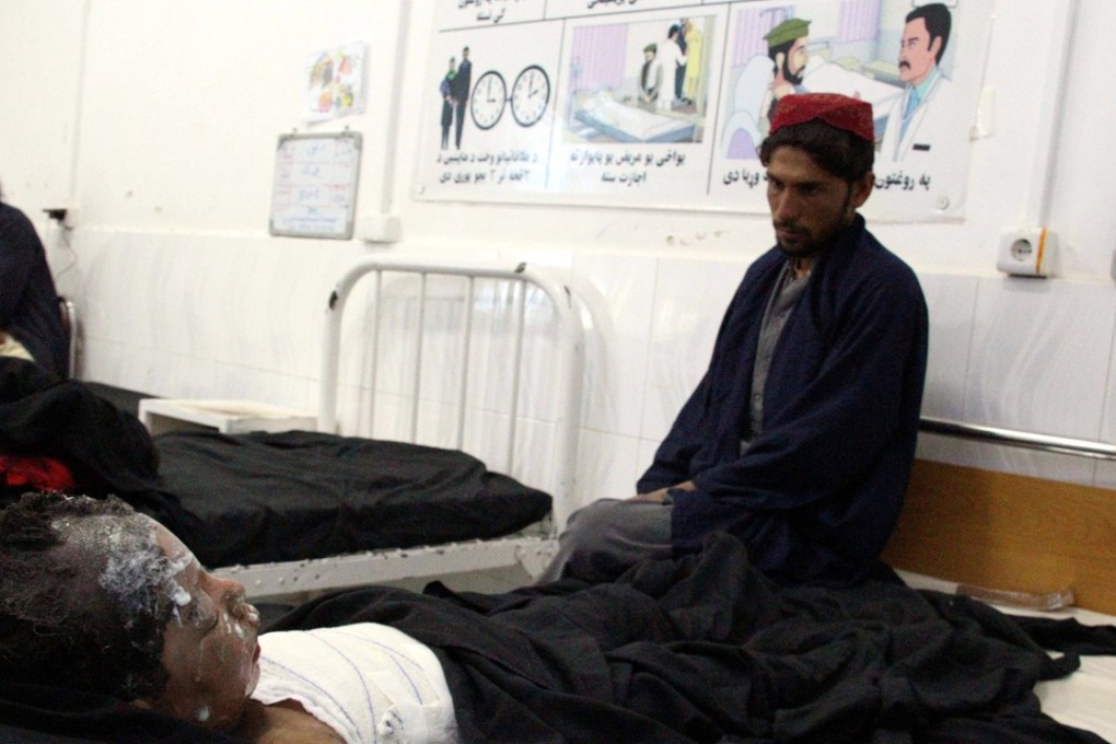 An injured boy receives treatment at a hospital after an air strike in Helmand province, southern Afghanistan. Photo: EPA-EFE