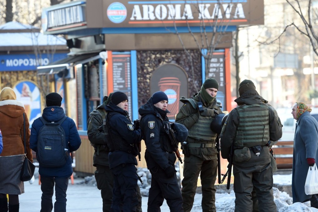 Servicemen of the Ukrainian National Guard patrol in the centre of Kiev. Photo: AFP