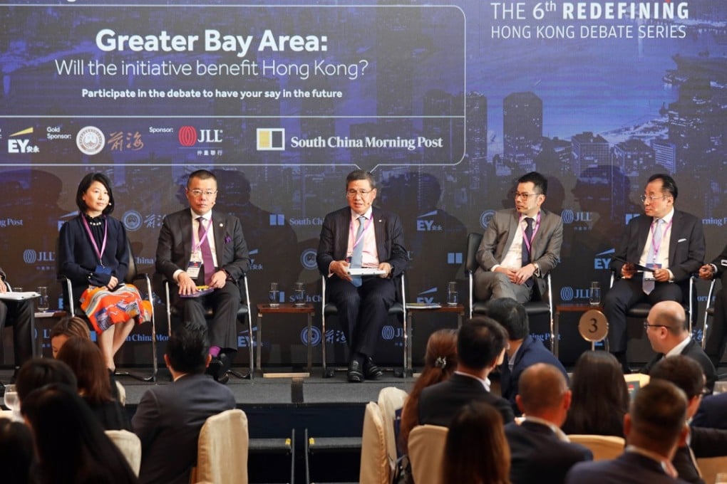 Panellists at the Redefining Hong Kong Debate Series panel discussion at the J W Marriott Hong Kong in Admiralty, from left to right: Tony Cheung, senior political reporter, South China Morning Post; Dr Yifan Hu, chief China economist, UBS Global Wealth Management; Witman Hung, principal liaison officer for Hong Kong, The Shenzhen Qianhai Authority; Albert Ng, chairman, China; managing partner, Greater China, EY; Denis Ma, head of research, Hong Kong, JLL; Joseph Chan, chairman, Silk Road Economic Development Research Centre; and Yonden Lhatoo, chief news editor, South China Morning Post. Photo: Xiaomei Chen