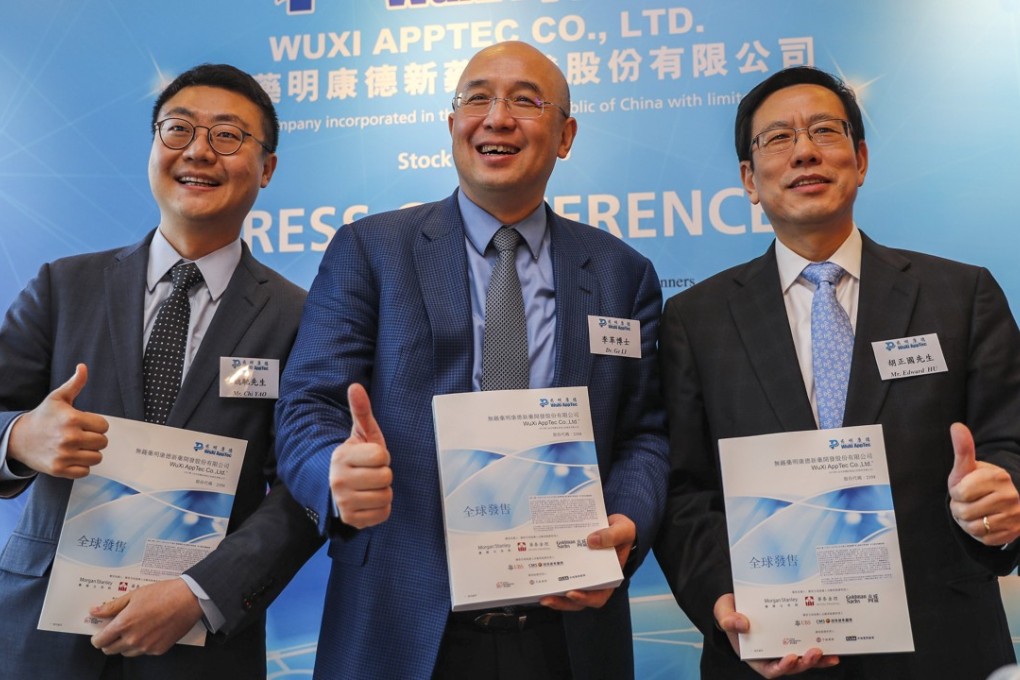 (From left): Wuxi AppTec board secretary Chi Yao, chairman Li Ge and CFO Edward Hu, at the company’s press conference to announce its Hong Kong IPO, on Friday. Photo: Edward Wong
