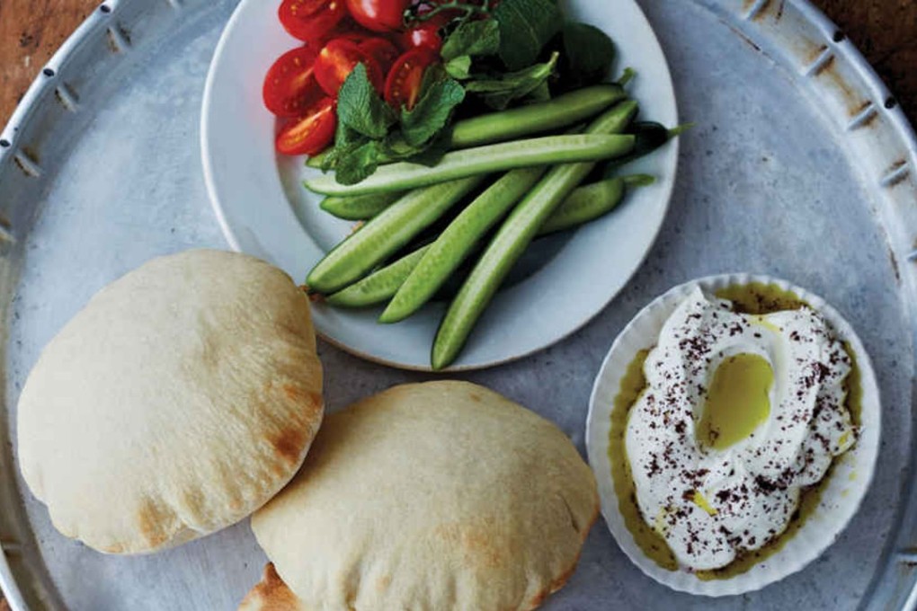 Crudités, pita bread and hummus, in an image from the book.