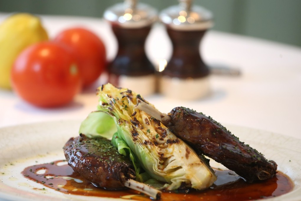 Confit duck leg with orange glaze at La Petite Maison in Central. Photo: David Wong