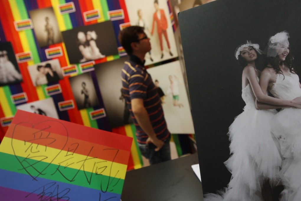 Hong Kong’s first-ever same sex marriage wedding service organiser BEvisible Production makes its debut at the Hong Kong Wedding Expo at the Convention and Exhibition Centre, Wan Chai, in June 2013. Since then, a slew of court cases have seen progressive judgments on same-sex unions, but legislation has not kept up. Photo: David Wong