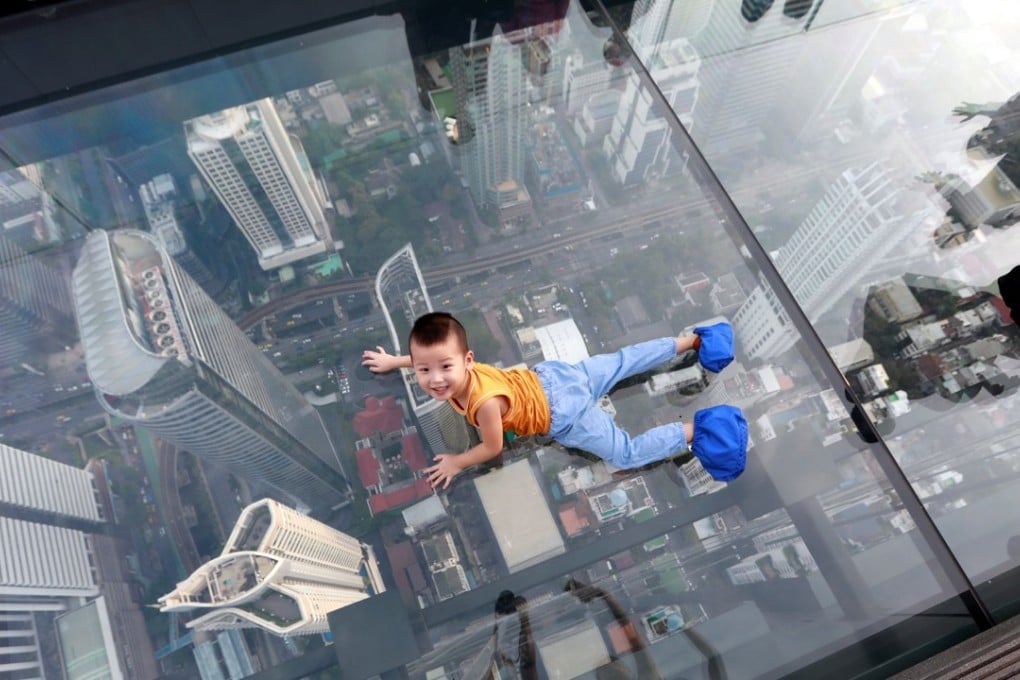 The recently opened 314-metre-high Mahanakhon Skywalk, atop Thailand’s tallest building, boasts panoramic views across Bangkok and highlights the speed at which the capital has developed. Photo: Reuters