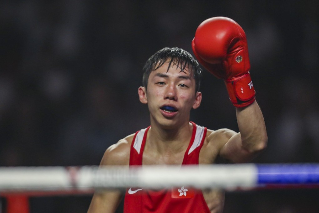Hong Kong boxer Rex Tso raises his left fist after winning his comeback fight at Southorn Stadium. Photos: Winson Wong
