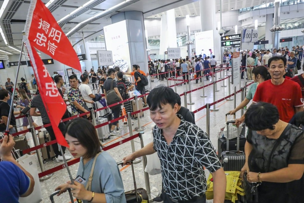 Mainland tourists arriving at Hong Kong's West Kowloon terminus for the high-speed rail. Photo: Felix Wong