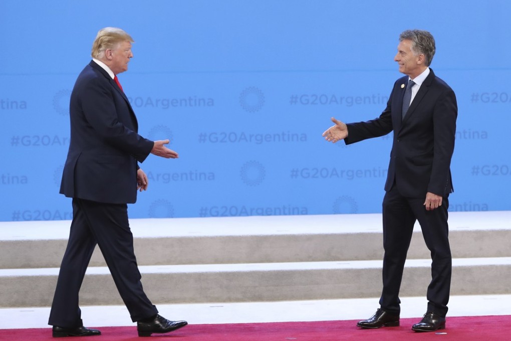 Argentine President Mauricio Macri (right) welcomes US President Donald Trump to the start of the G20 summit in Buenos Aires on Friday. Photo: AP