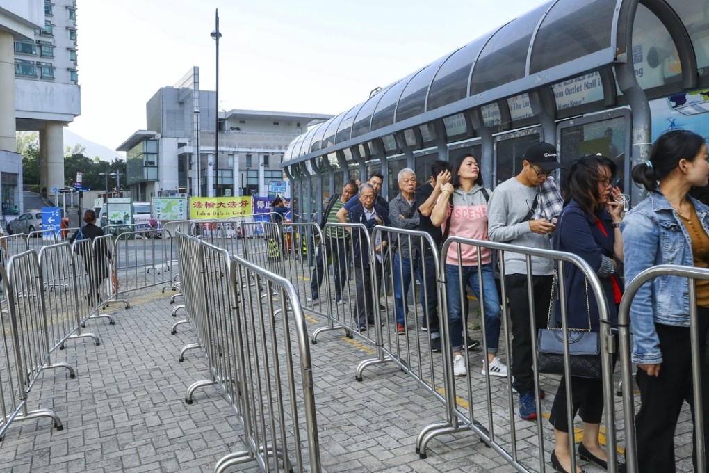 Tourists at a bus terminal in Tung Chung, with services offering transport back to the bridge. Photo: Edmond So