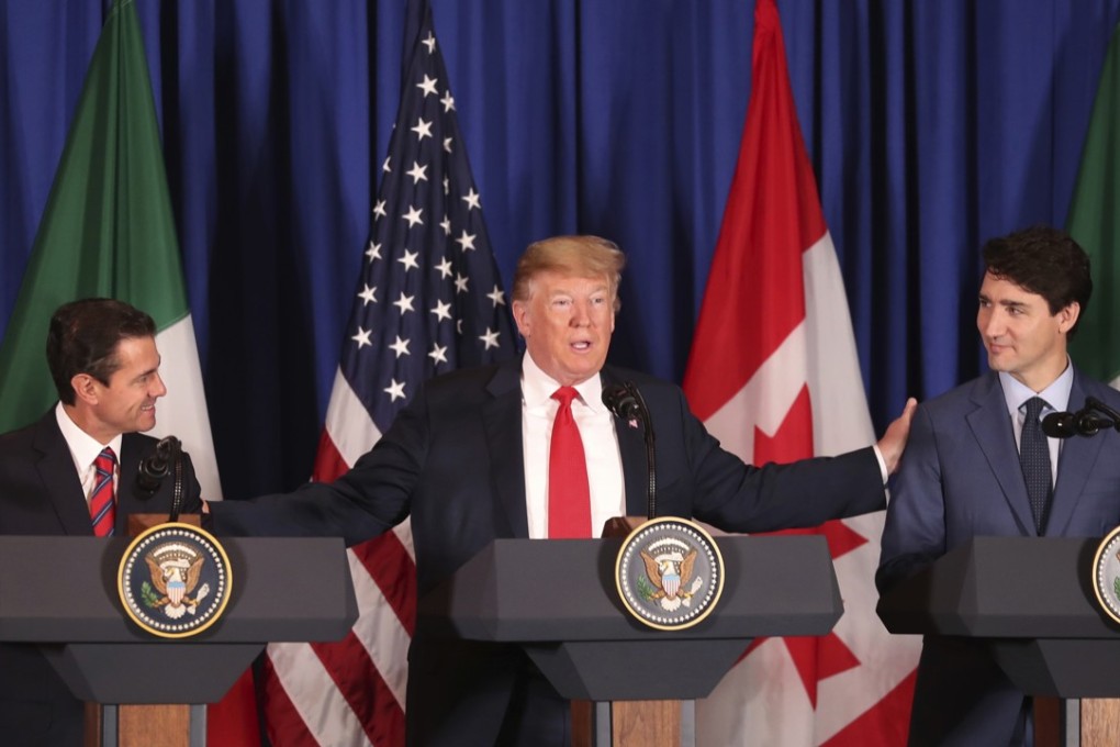 From left, Mexican President Enrique Pena Nieto, US President Donald Trump and Canadian Prime Minister Justin Trudeau as they prepare to sign a new United States-Mexico-Canada Agreement to replace the Nafta trade pact, during a ceremony before the start of the G20 summit in Buenos Aires, Argentina, on Friday. The pact must still be approved by lawmakers in all three countries. Photo: AP