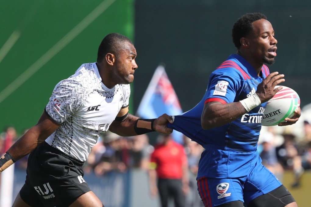 Alosio Sovita Naduva of Fiji chases Carlin Isles of the USA at the Dubai Sevens. Photo: AFP