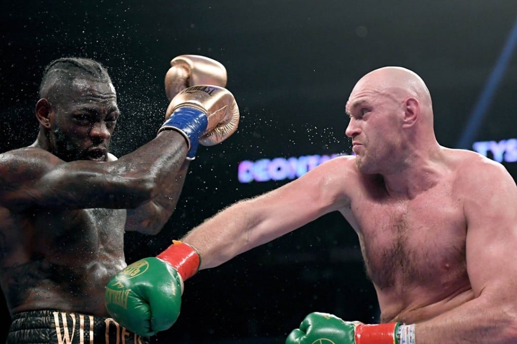 Tyson Fury throws a right hand against Deontay Wilder in the seventh round of their fight that ended in a controversial draw. Photo: AFP