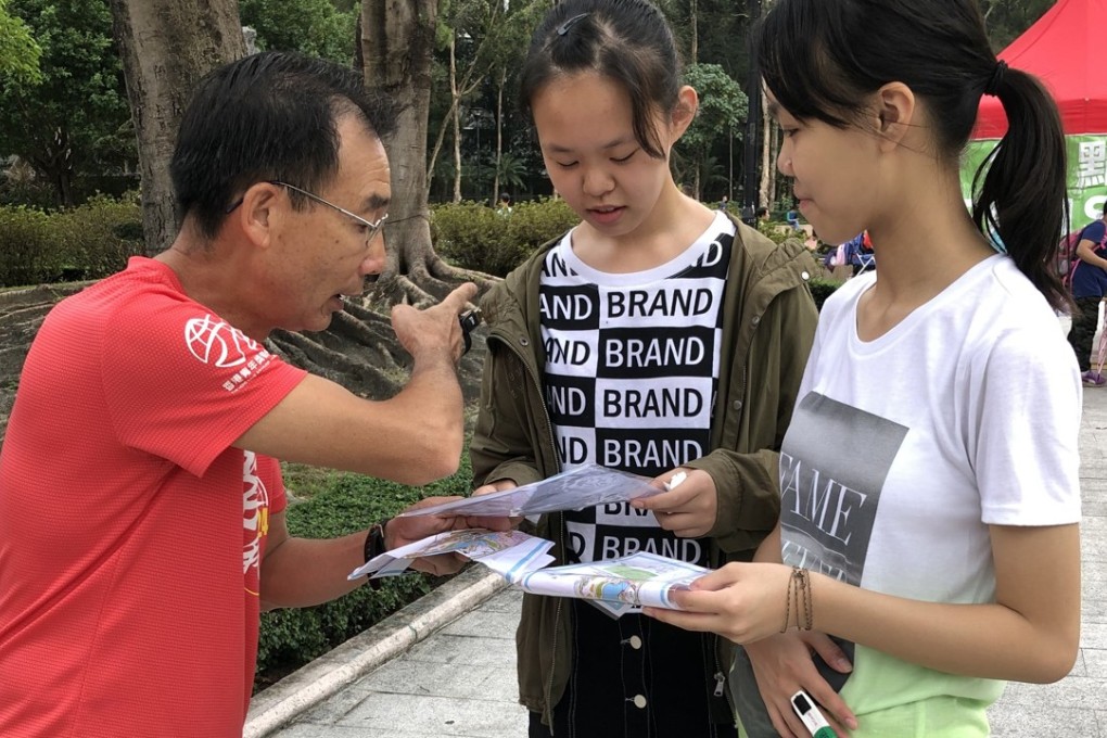 Three participants search for the correct route during the Orienteering@Park event in Tuen Mun Park, Hong Kong. Photo: Nora Tong