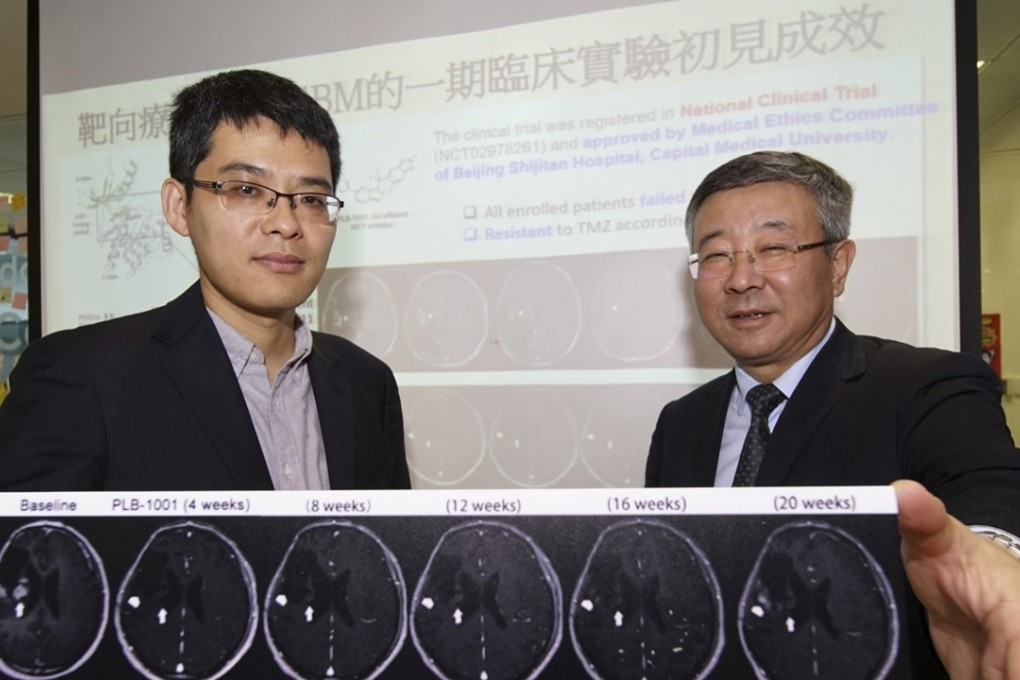 Wang Jiguang (left), assistant professor at the division of life science, department of chemical and biological engineering, HKUST, and Professor Jiang Tao (right) from Beijing Tiantan Hospital, showing results of the clinical trial. Photo: Hong Kong University of Science and Technology