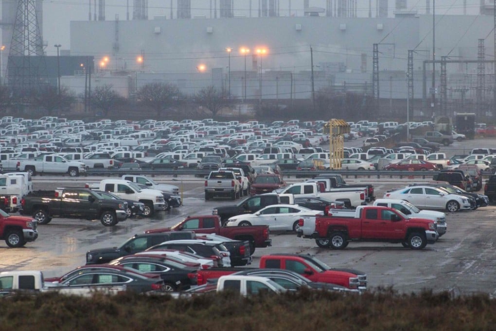 Vehicles parked outside the GM assembly plant in Oshawa, Ontario – a site earmarked for closure by the company, putting almost 3,000 jobs at risk. The weekend’s developments between the US and China over tariffs may offer hope of a respite on lay-offs. Photo: AFP