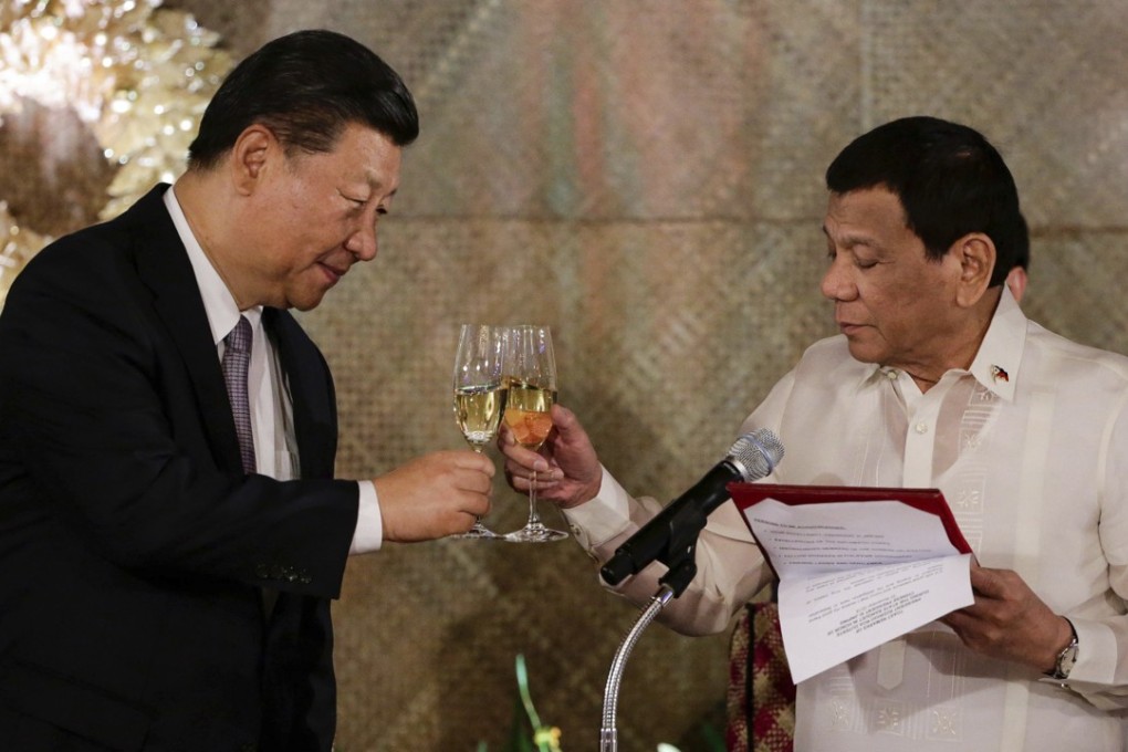 Chinese President Xi Jinping and Philippine President Rodrigo Duterte share a toast during a state banquet in Manila during Xi’s November visit. Photo: AP
