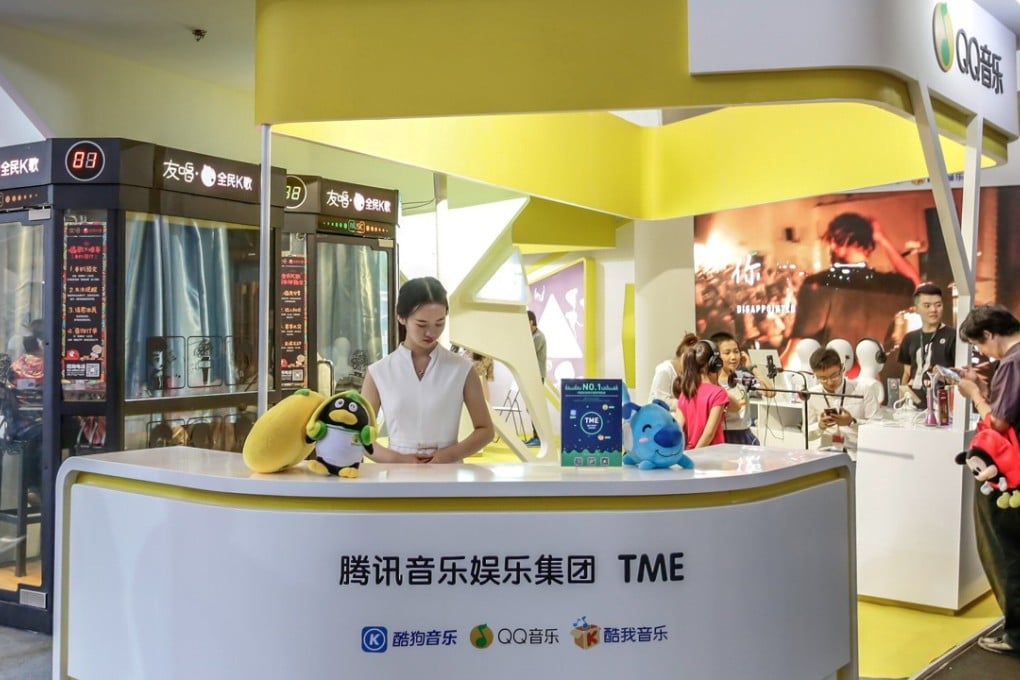 Visitors at a booth of Tencent Music Entertainment in Beijing, China. Photo: Reuters