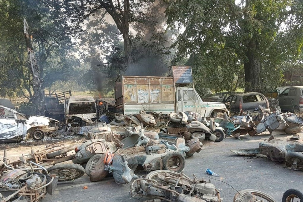 Smouldering vehicles litter the street following mob violence in Chingravati village in the Bulandshahr district of Uttar Pradesh. Photo: AFP