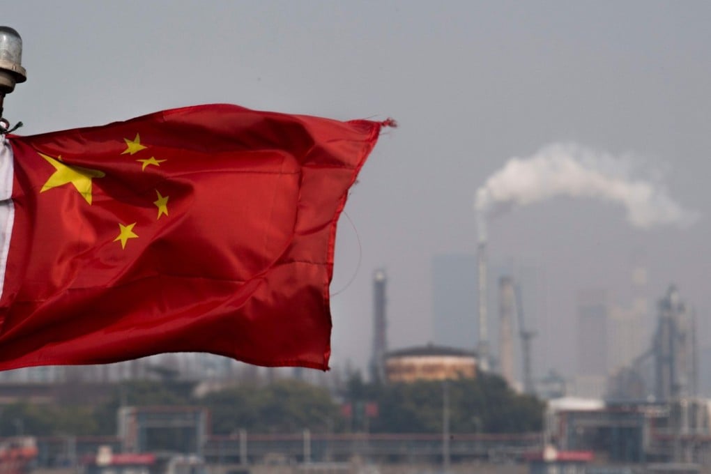 A Chinese flag flutters in front of a Sinopec Shanghai Gaoqiao refinery. China’s yuan-denominated oil futures, launched in March, have overtaken in volume the dollar-denominated oil futures traded in Singapore and Dubai. Photo: AFP