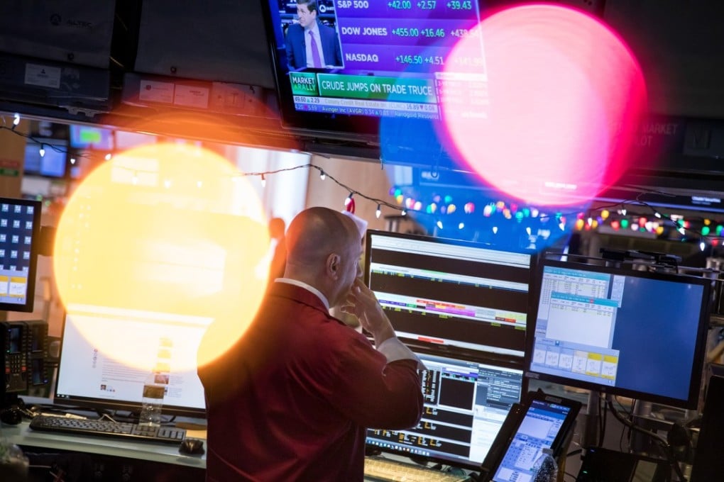 A trader works on the floor of the New York Stock Exchange on Monday. Stocks climbed after the US and China declared a truce in their trade war, while Treasuries and the dollar fell. Photo: Bloomberg