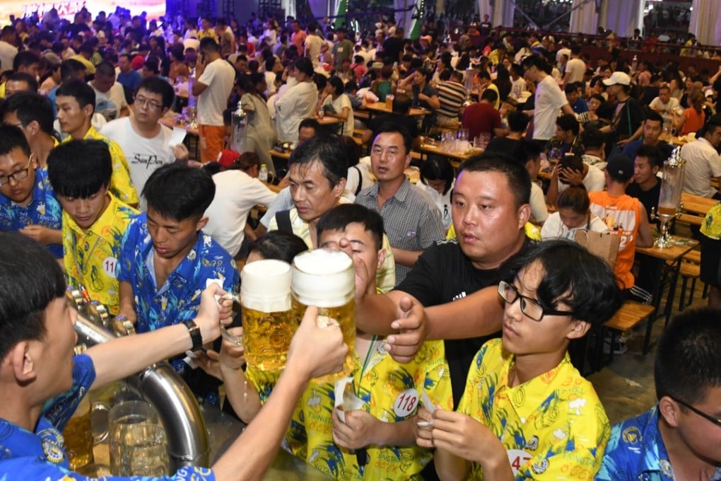 Customers at the 28th Qingdao International Beer Festival held in eastern Shandong province in July are part of a growing market for premium beers. Photo: Xinhua