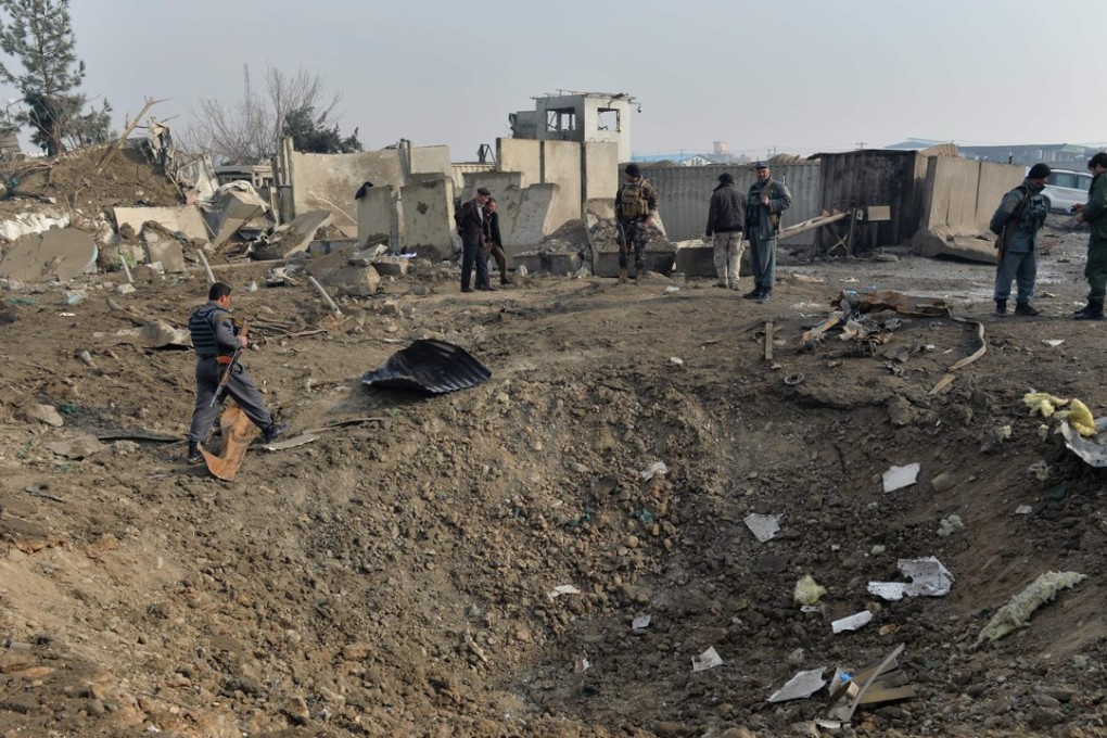 Afghan security forces gather at the site of a suicide bomb attack in Kabul, Afghanistan last month. Photo: AFP